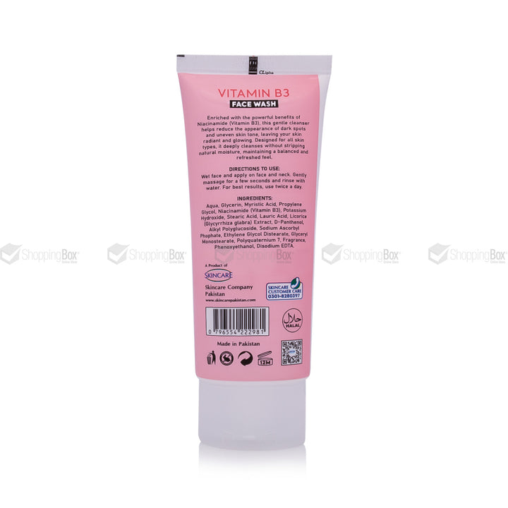 Pink tube of Vitamin B3 face wash with text and branding on a white background