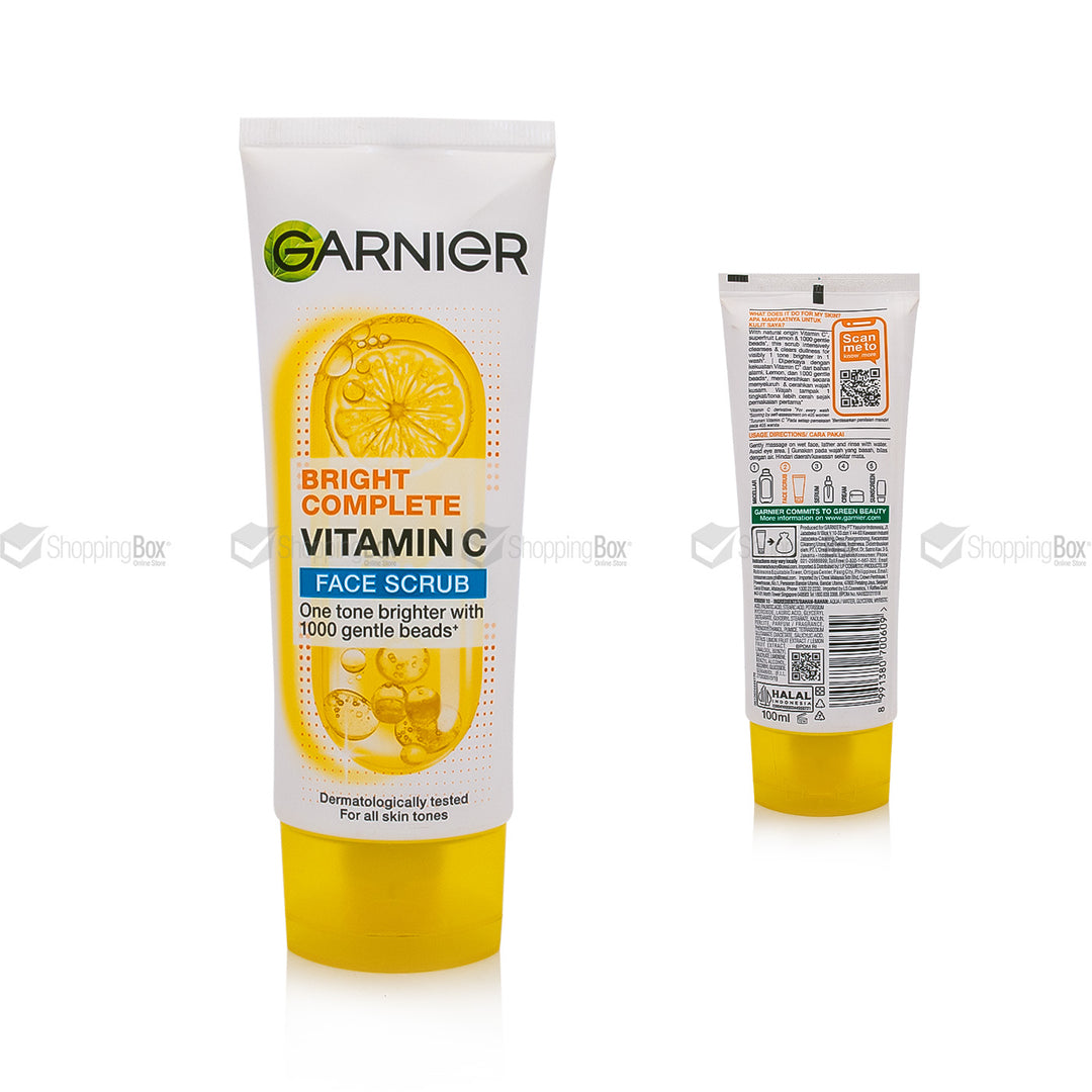 Garnier Bright Complete Vitamin C Face Scrub in a white squeeze tube with a yellow cap, shown from the front and back on a white background.