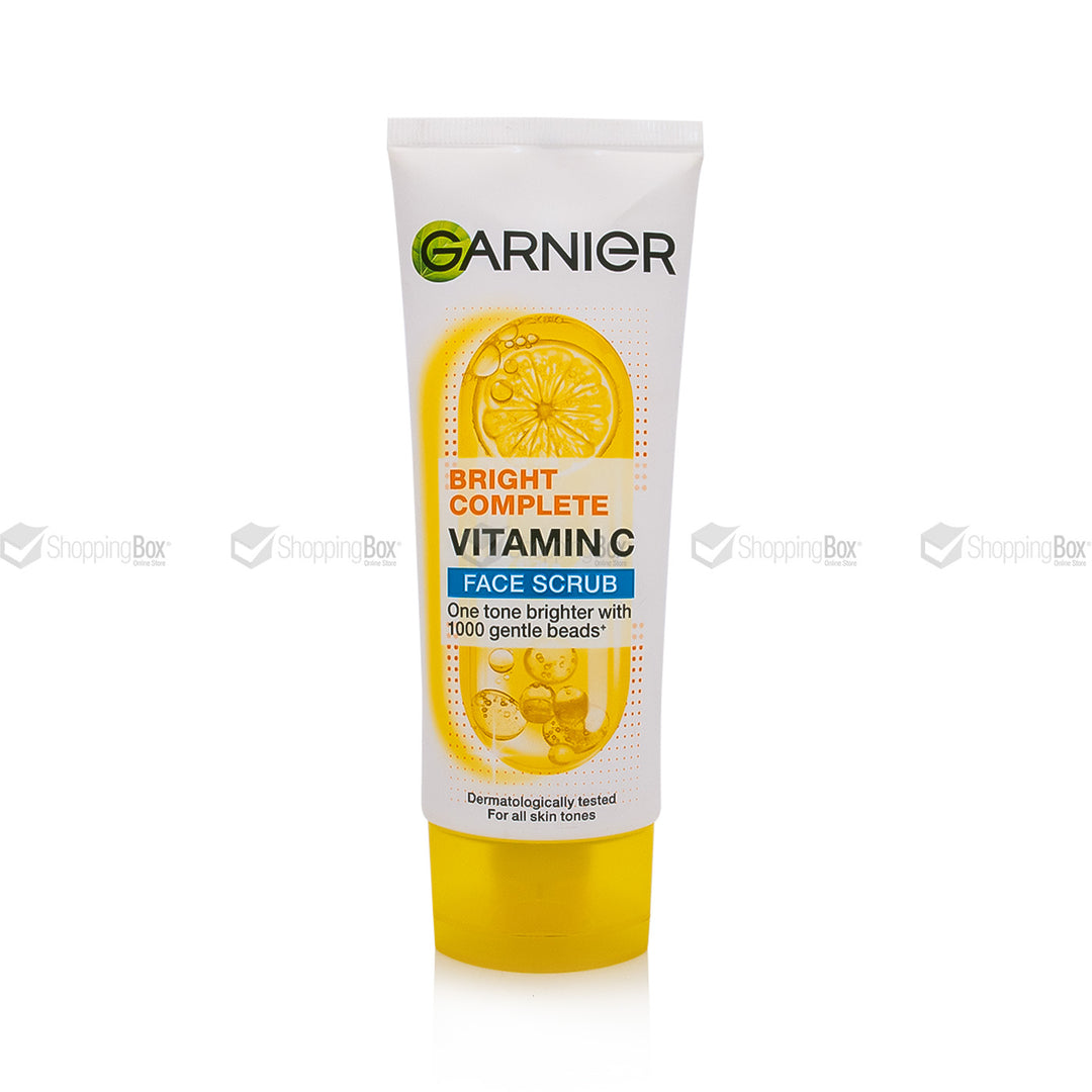 Garnier Bright Complete Vitamin Face Scrub in a white squeeze tube with a yellow cap, featuring a lemon graphic on the label.