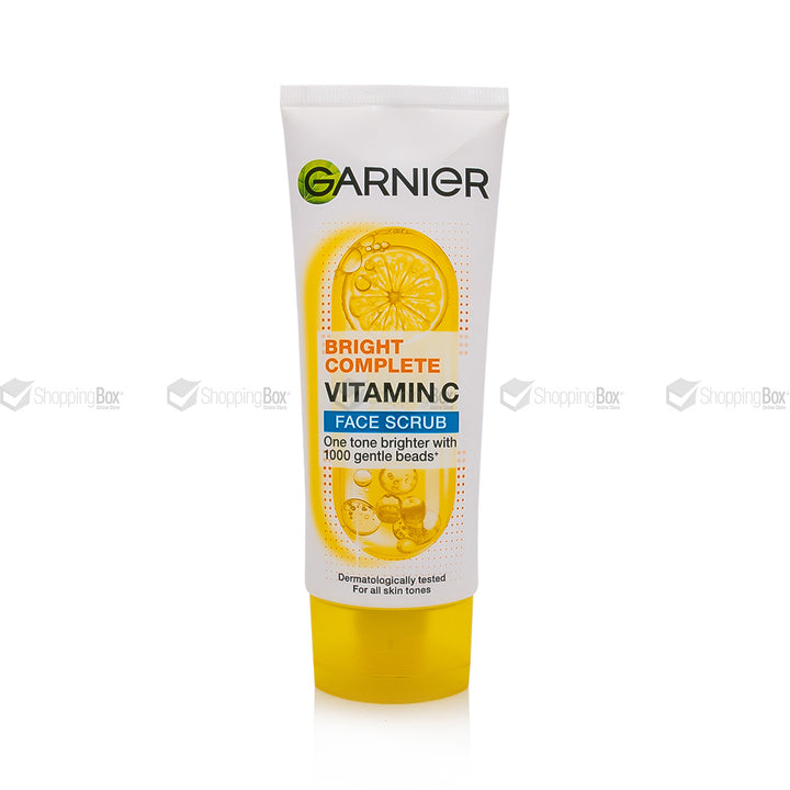 Garnier Bright Complete Vitamin Face Scrub in a white squeeze tube with a yellow cap, featuring a lemon graphic on the label.