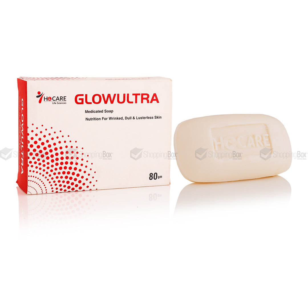 A packaged bar of GLOWULTRA medicated soap with its corresponding box, which features a predominantly red and white color scheme with text and branding.